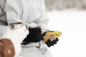 Winter cycling: food and drink breaks for instant energy and hydration.